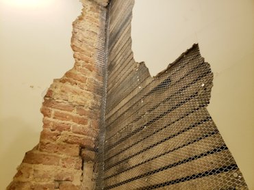 Old wood lath is covered with metal lath.