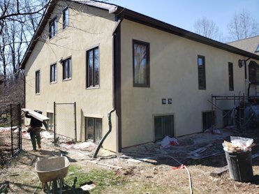 Cedar siding replaced with stucco in Bethesda, Maryland.