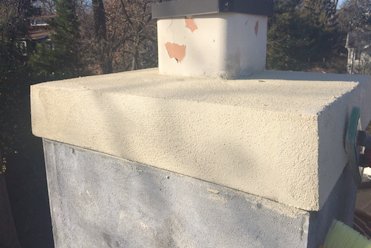 A band on top protects the chimney by providing a drip edge