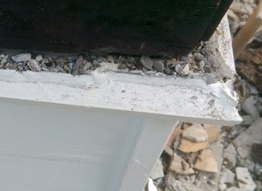 Old wood trim at the bottom of
                the wall never had flashing
