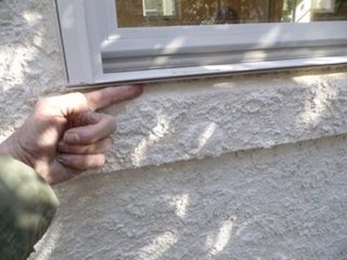 a gap is left under the drip edge of the window