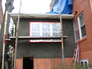 Brown coat on stucco addition