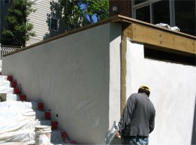 Stucco finish is troweled smooth