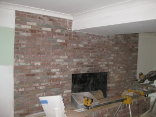 Stucco fireplace before