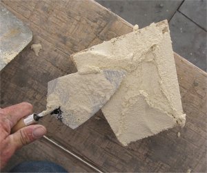 Mortar is spread on back to stick keystone in place
