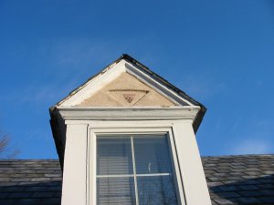 Stucco replaced Baltimore, Maryland dormers.