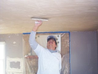 trowels down the living room ceiling