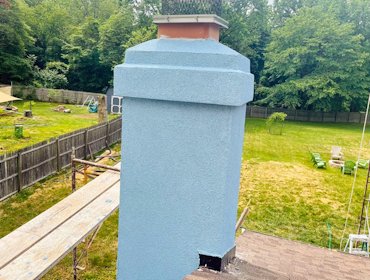Chimney finished with blue stucco.