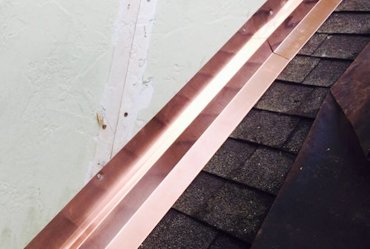 New copper counter flashing on roof intersections.