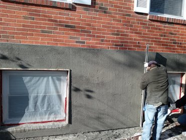 Stucco is a great solution to spalling brick.