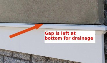A gap for drainage is left over the flashing