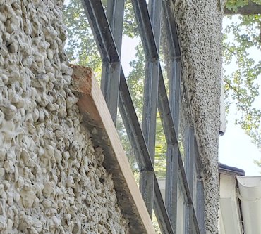 Sill projects well past the stucco.