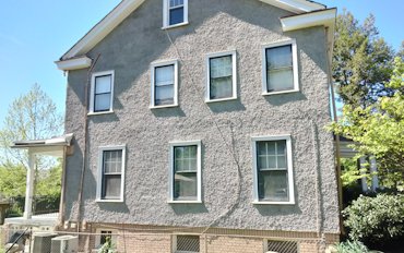 Pebble dash stucco replaced on this 1923 house in Washington, DC.