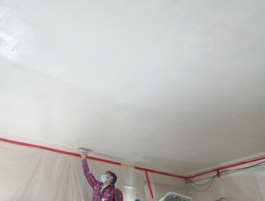 Finish plaster is troweled smooth.