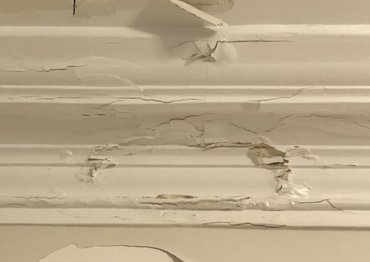 Moldings are damaged by a plumbing leak.