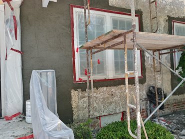 Areas where stucco was removed were filled with new lath and cement mortar.