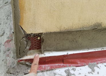 Gaps from flashing installation, expansion joints, etc. are filled with lath
	    and mortar with flexcon