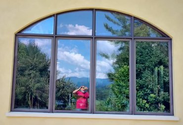 the reflection of the mountains in the window.