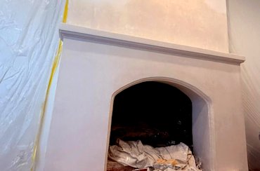 Finished color plaster fireplace.