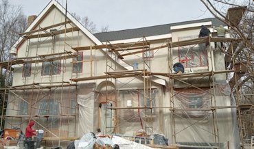 Stucco finish coat on front of this addition in Arlington, Virginia