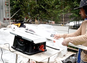 A table saw is used to cut the back of the sill.