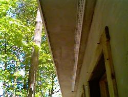 Aluminum soffit vent on stucco soffit